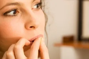 Woman biting nails